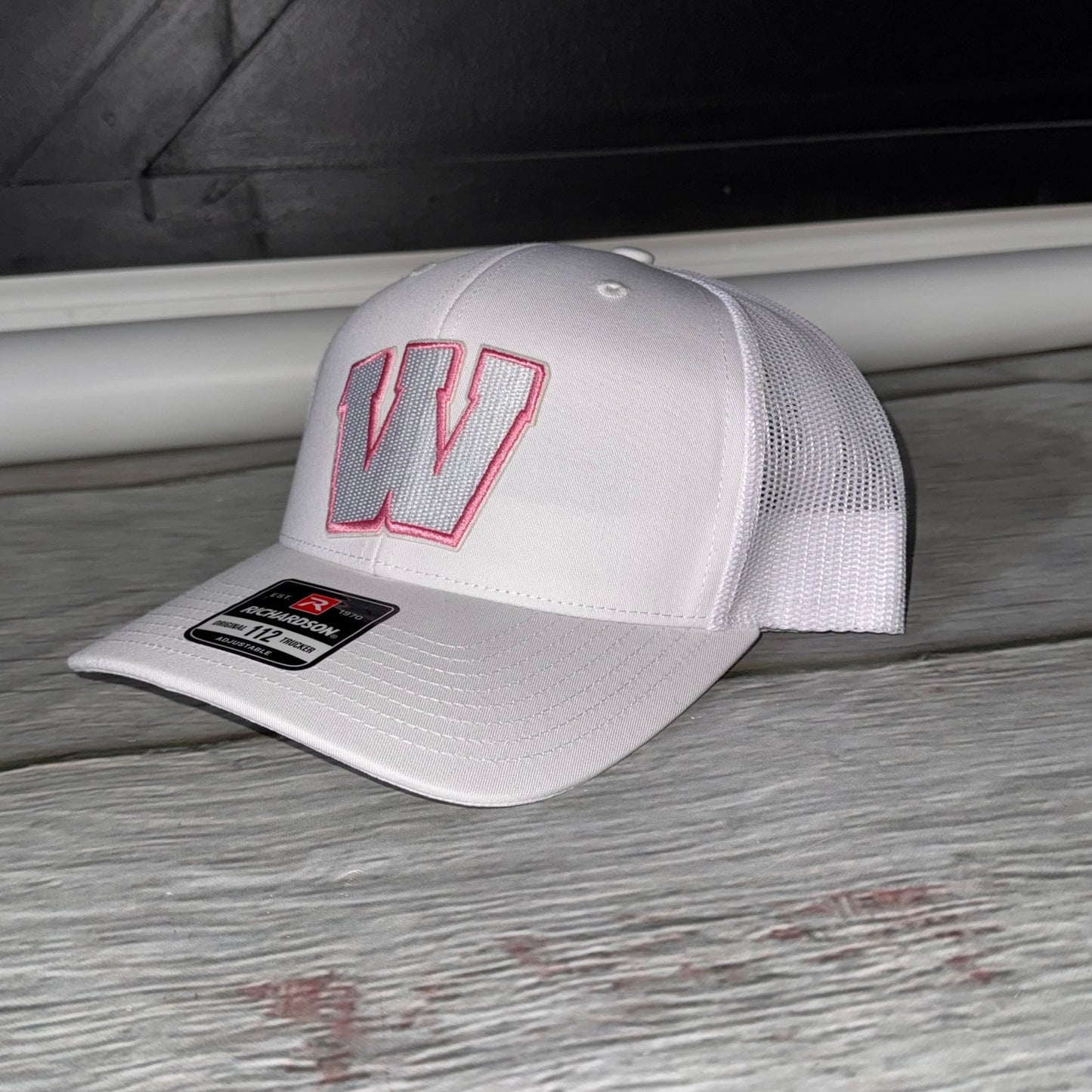 Pink out white and pink Weddington structured Trucker hat embroidered W patch