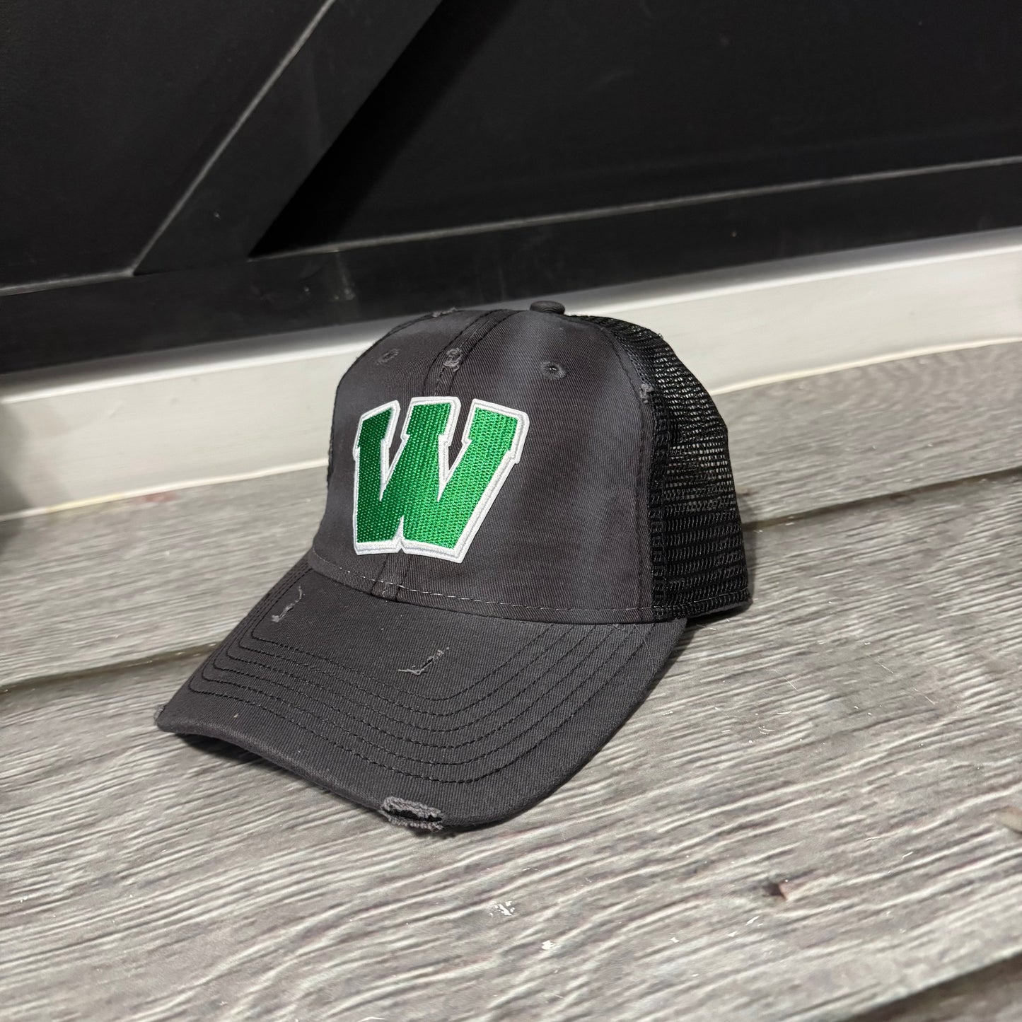 Distressed Black Trucker hat embroidered W patch