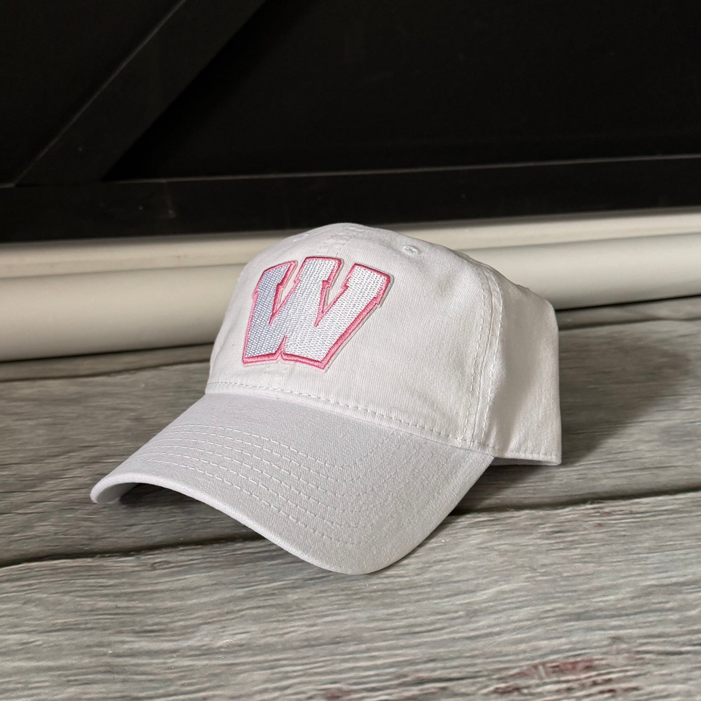 Pink out white and pink Weddington unstructured Trucker hat  embroidered W patch