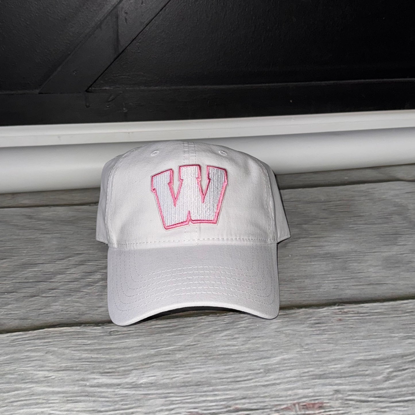Pink out white and pink Weddington unstructured Trucker hat  embroidered W patch